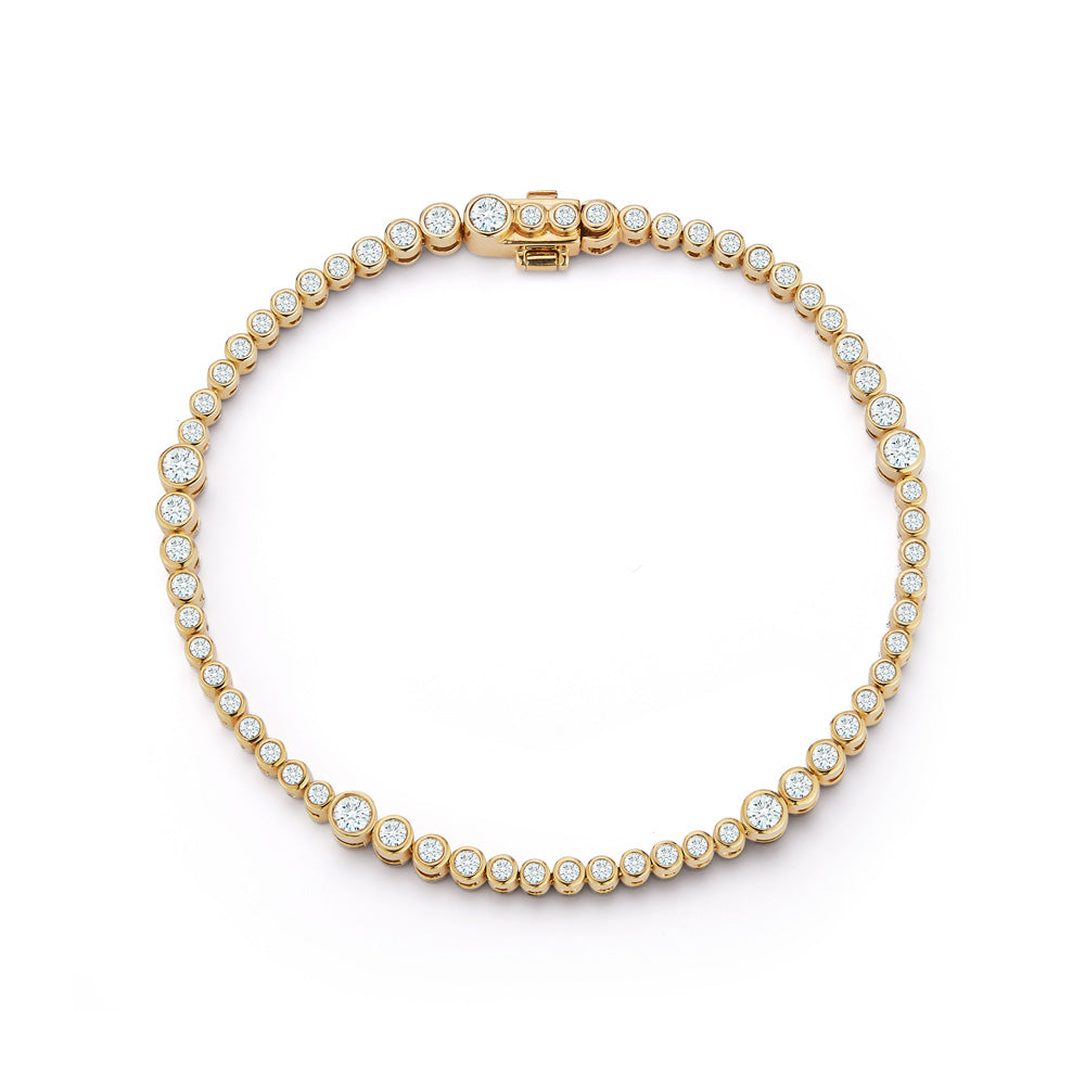 A yellow gold Rainsun Tennis Bracelet.