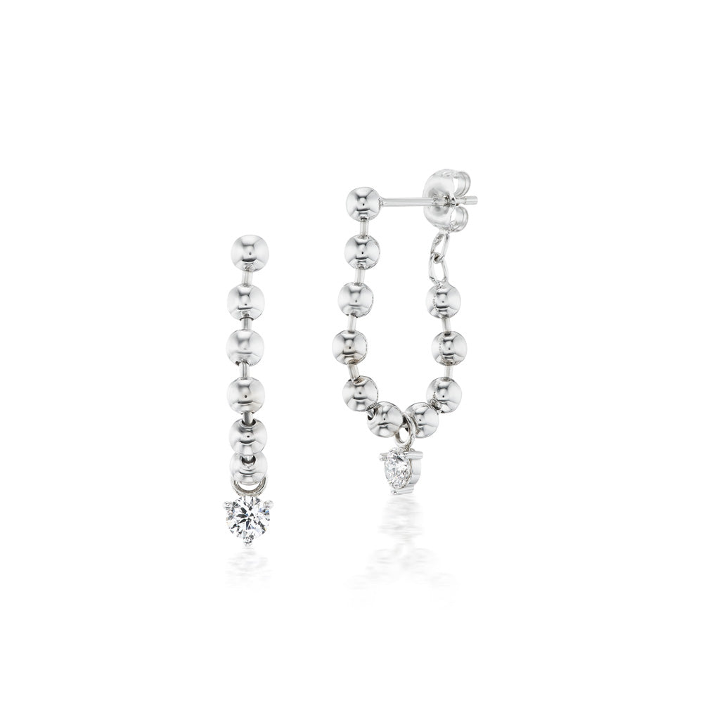 A stunning pair of Vice Versa Kin Drop Earrings in white gold, adorned with brilliant white diamonds.