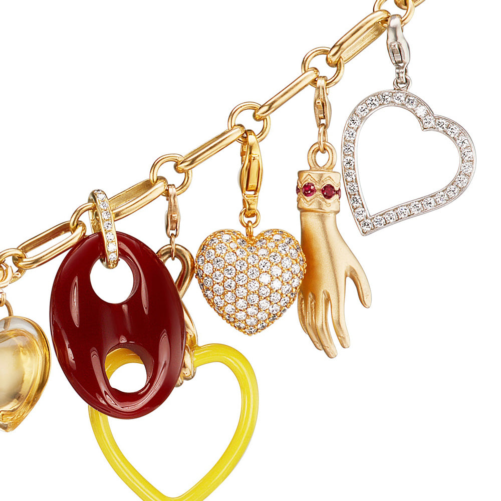 A Buddha Mama Small Puffy Heart Diamond Charm necklace with a variety of yellow gold charms.
