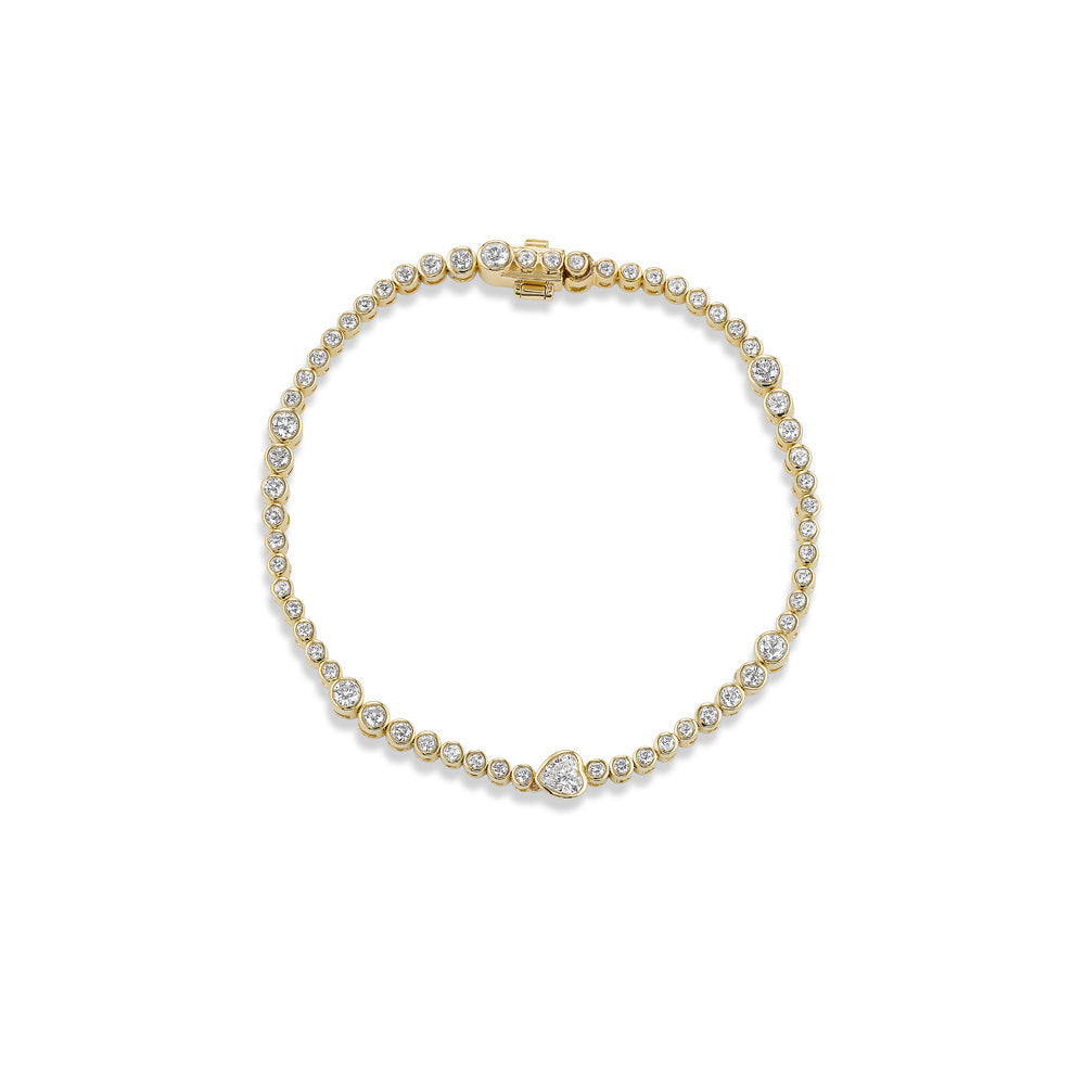 A yellow gold Heart Rainsun tennis bracelet with white diamonds by Ondyn.