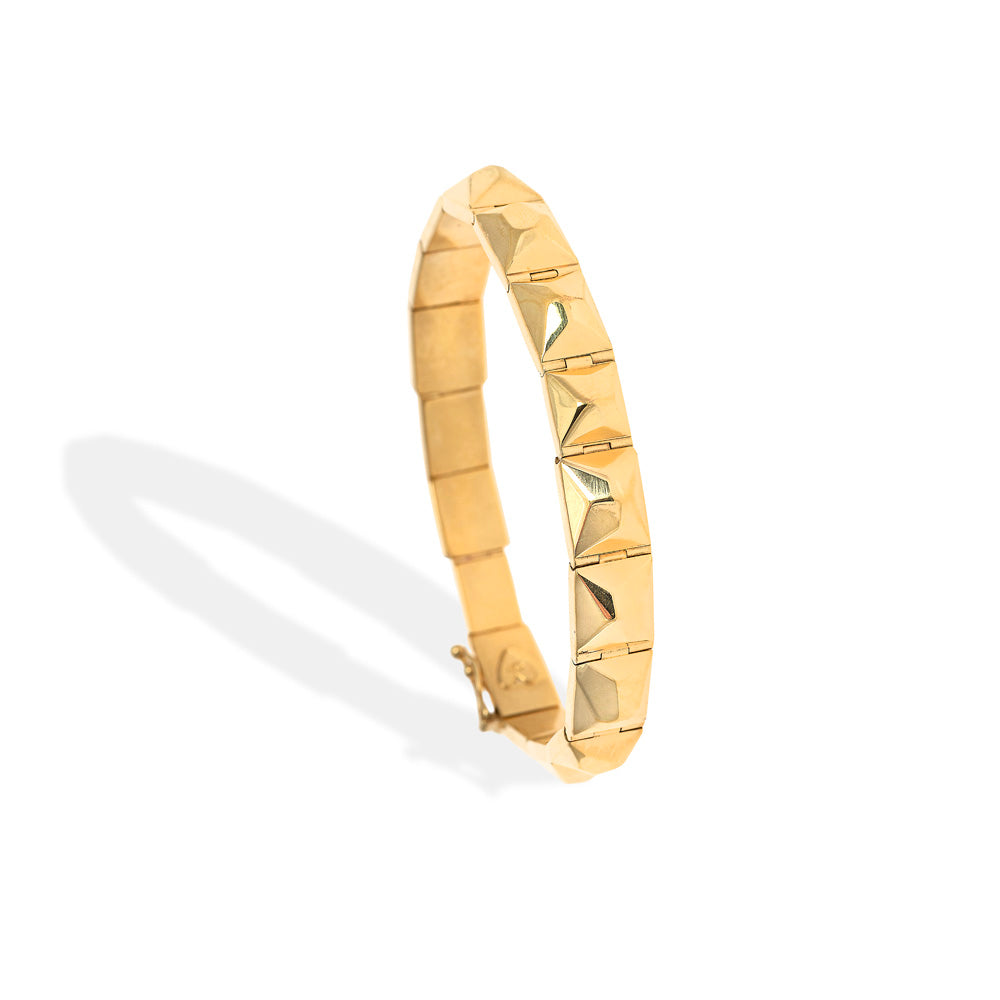 A Christina Alexiou Pyramid Bracelet with a geometric design and interlocking clasp.