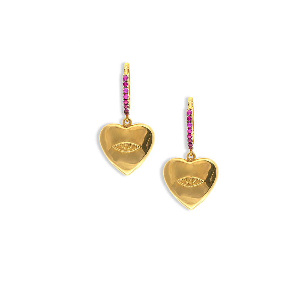A pair of Christina Alexiou Protective Eye Heart Earrings with pink sapphires.