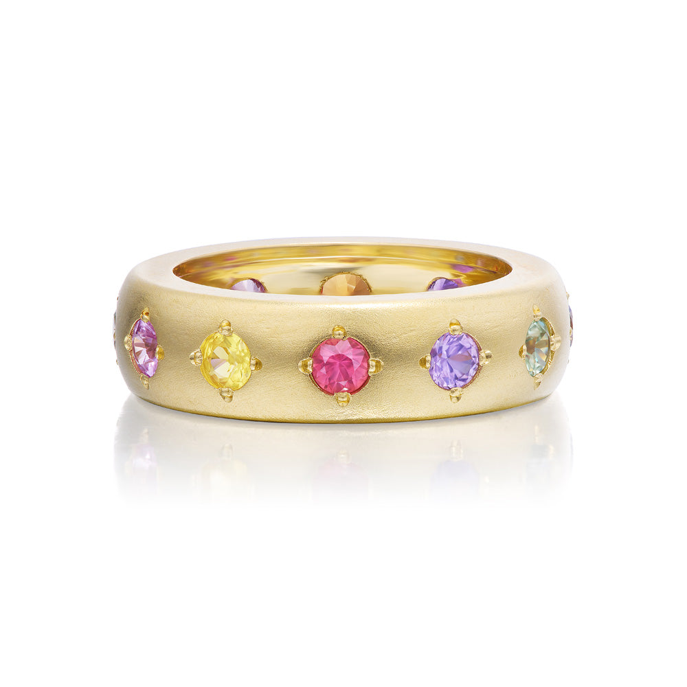 A Jenna Blake Gypsy Ring with multi colored sapphires and a satin finish.
