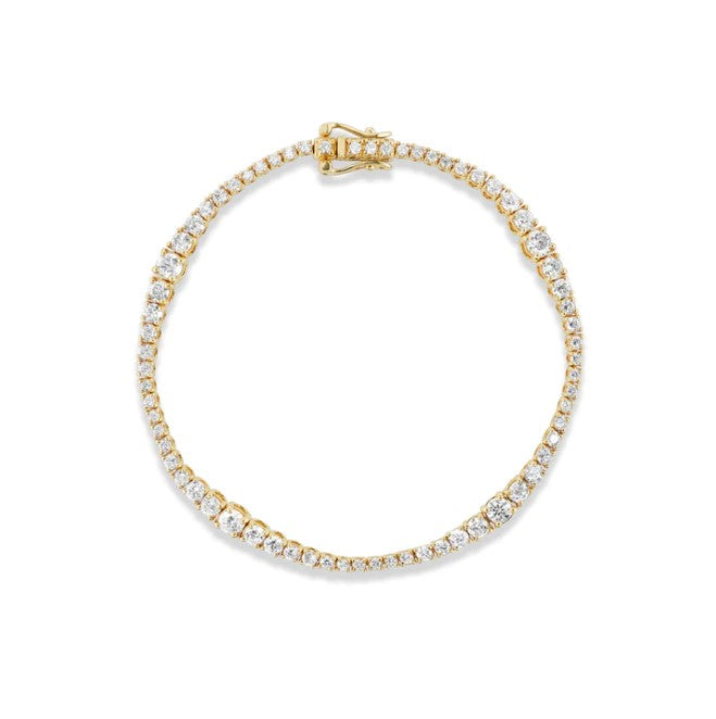A Vice Versa Jones Bracelet, handcrafted with 14 karat yellow gold, adorned with natural white diamonds.