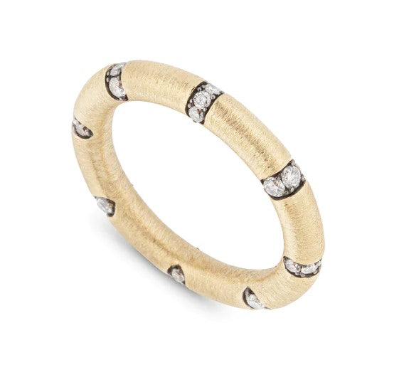 A Lucy Delius yellow gold ring with channel set diamonds.