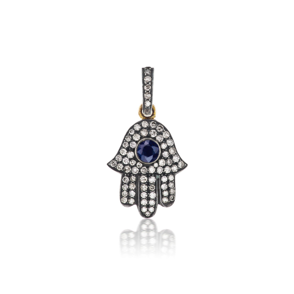 Munnu Diamond Hamsa Charm adorned with sapphires.