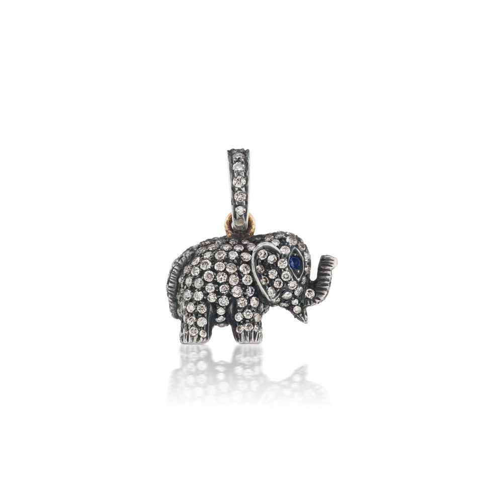 The Munnu Diamond Elephant Charm showcases stunning blue sapphire eyes.
