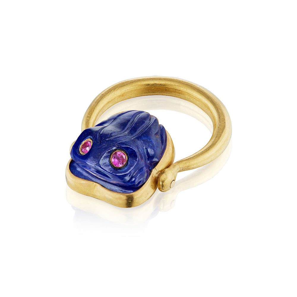 A Munnu Frog Ring adorned with lapis lazuli and pink sapphires.