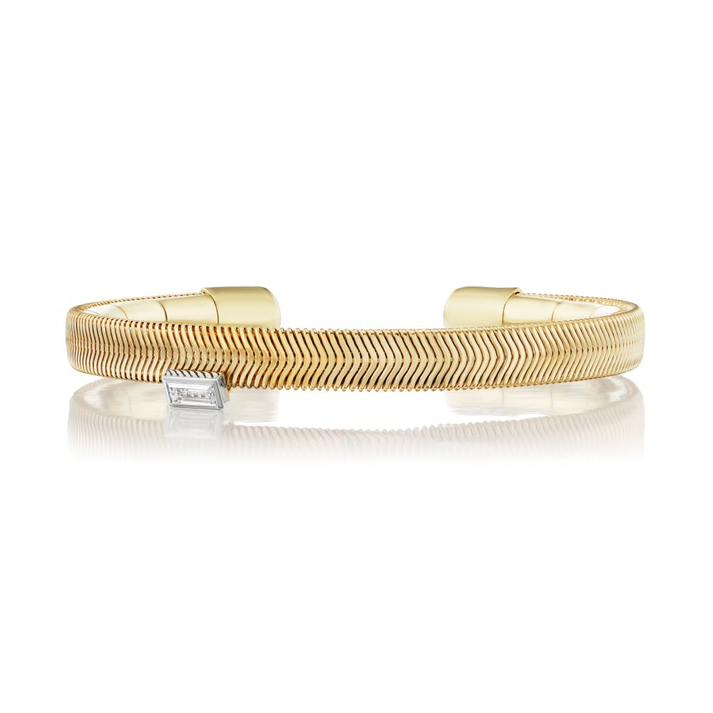 A Baguette Feelings cuff bracelet with a diamond by Nikos Koulis.