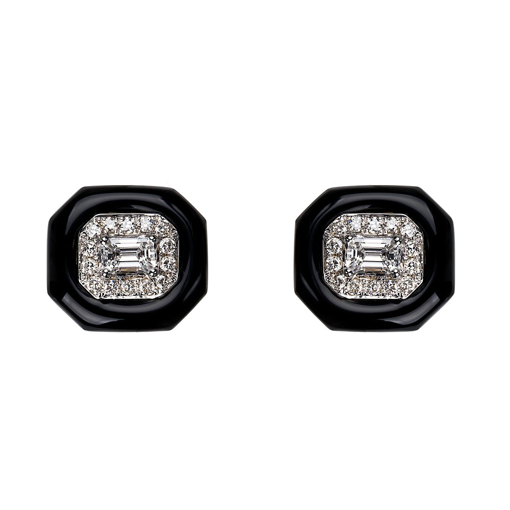 A pair of Nikos Koulis Oui studs featuring emerald cut black and white diamond pavé.