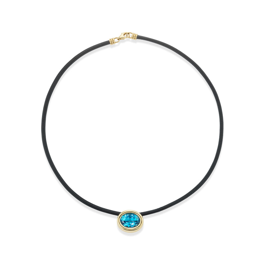 A Scuba Choker Necklace with a blue topaz stone on a leather cord by Beck.