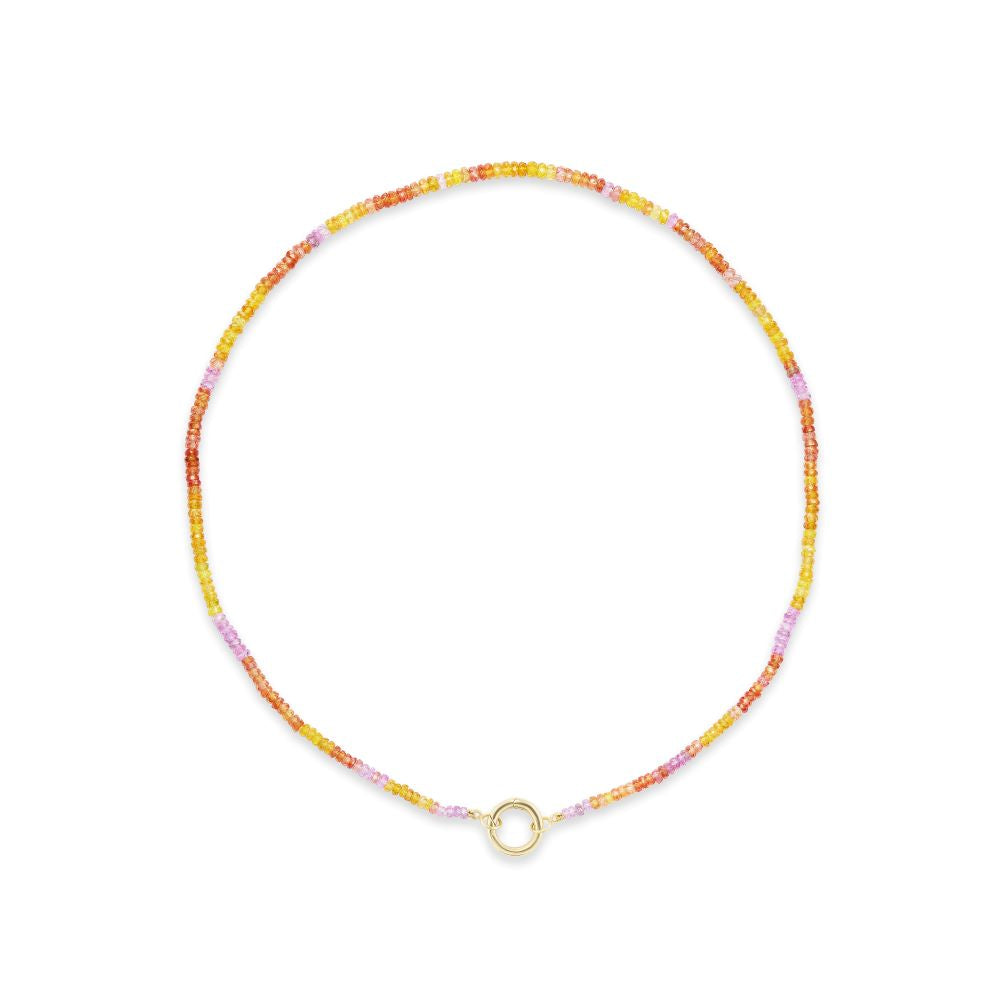 A Sapphire Beaded Necklace with a gold charm by Anna Maccieri Rossi.