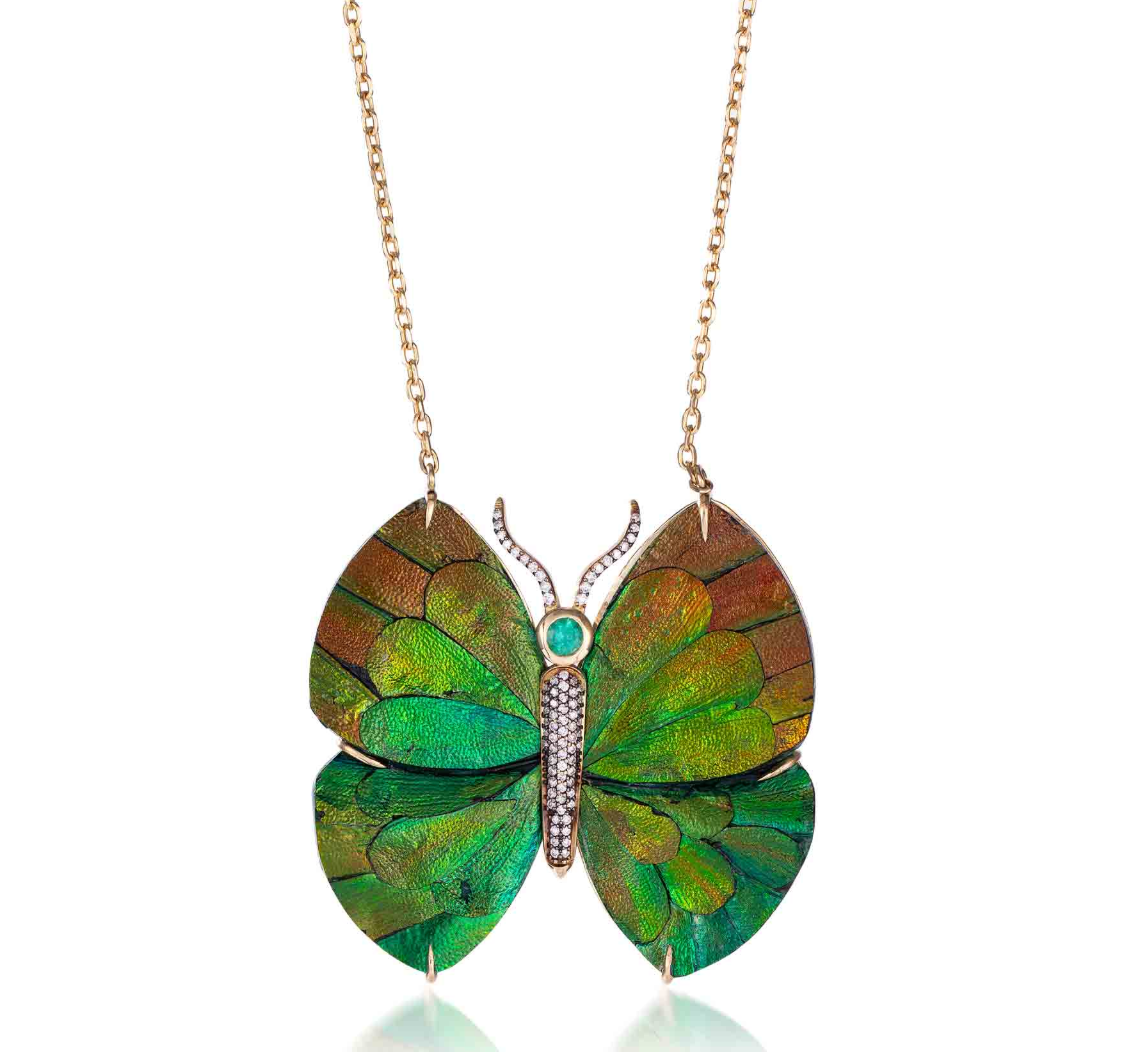 Wood butterfly necklace with beetle wing application and emerald in yellow gold