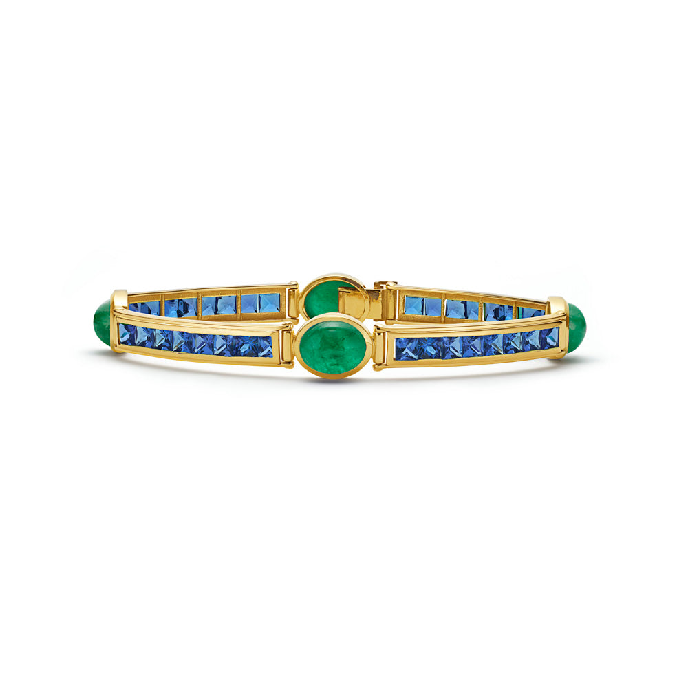 A VAN Stack Bracelet with square cut and cabochon emerald and blue sapphire stones.