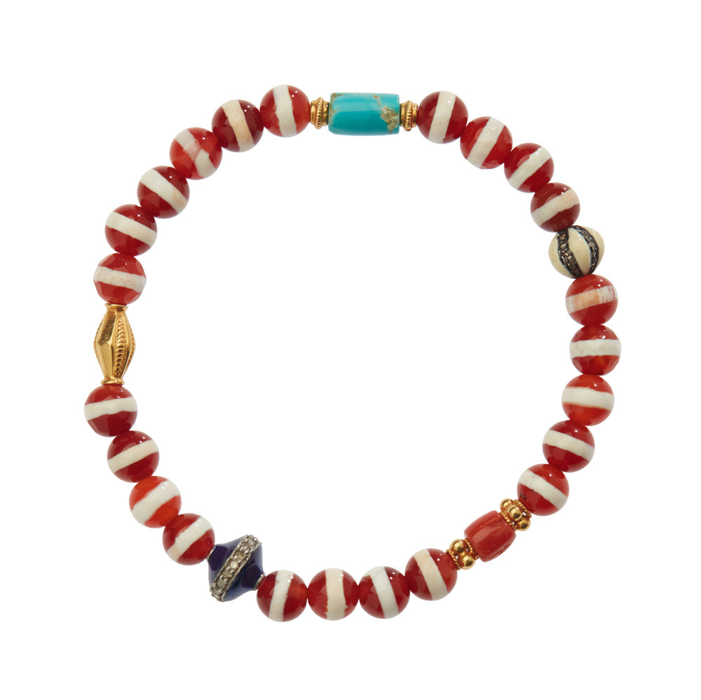 An Ileana Makari red and white Tibetan agate beaded bracelet with a gold bead.