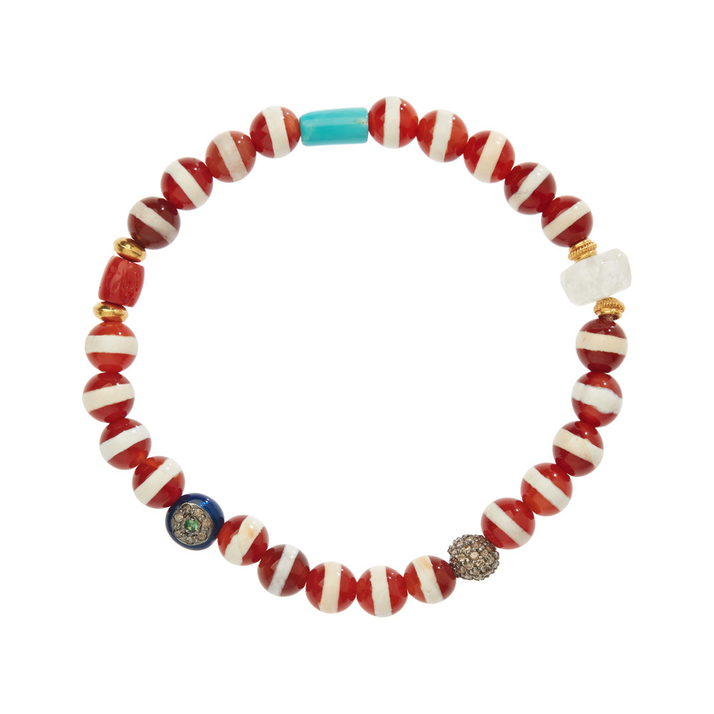 An Ileana Makari Red Agate Beaded Bracelet adorned with vibrant Tibetan agate beads, featuring shades of red, white, and blue. These semi-precious stones add a touch of natural beauty and eye-catching colors.