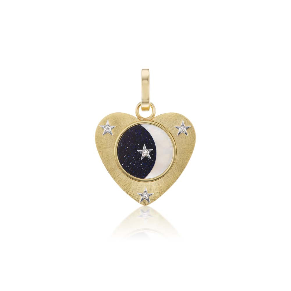 An Anna Maccieri Rossi yellow gold heart shaped pendant with diamond accented stars and a silk finish.