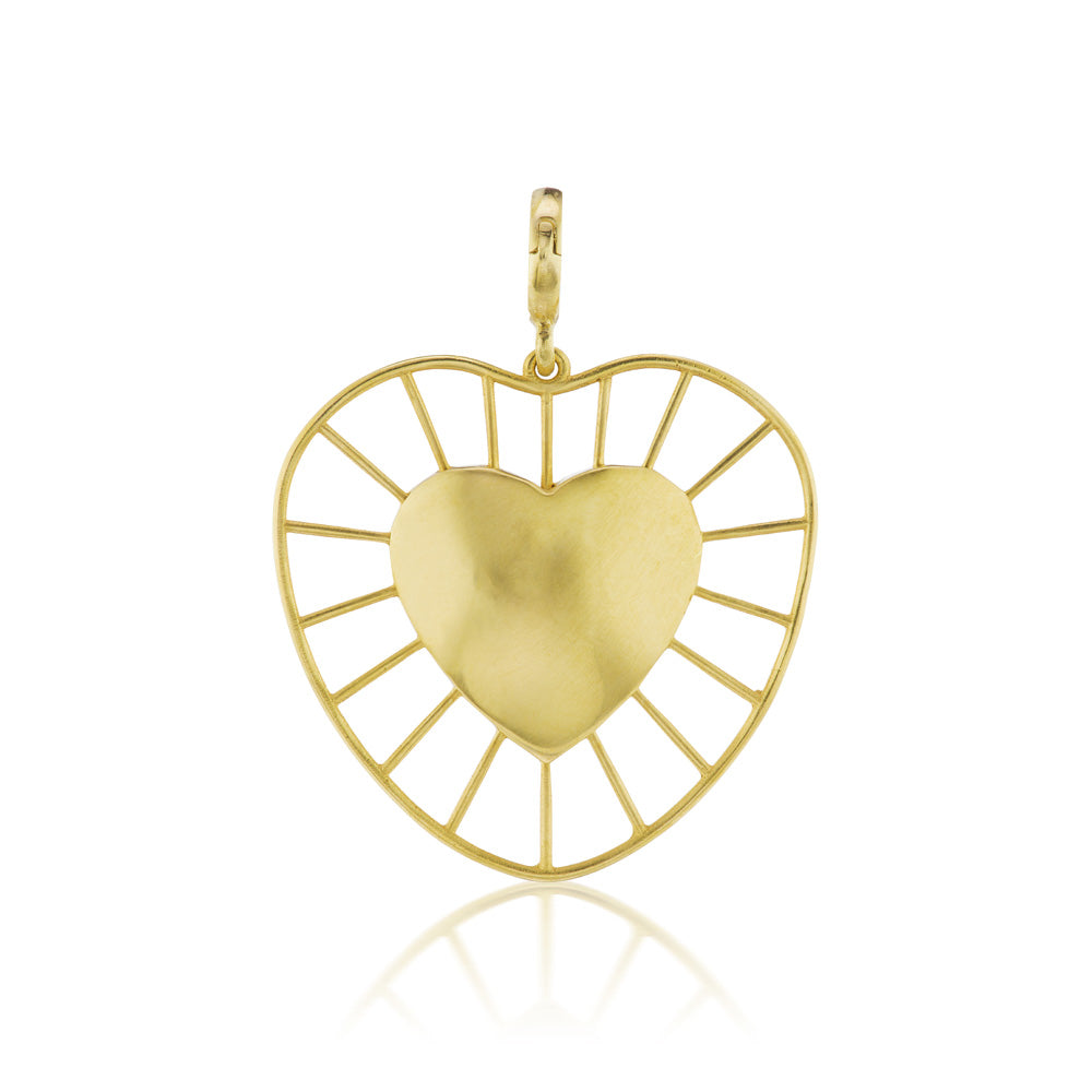 A Christina Alexiou Radial Heart Charm, Small in yellow gold on a white background.
