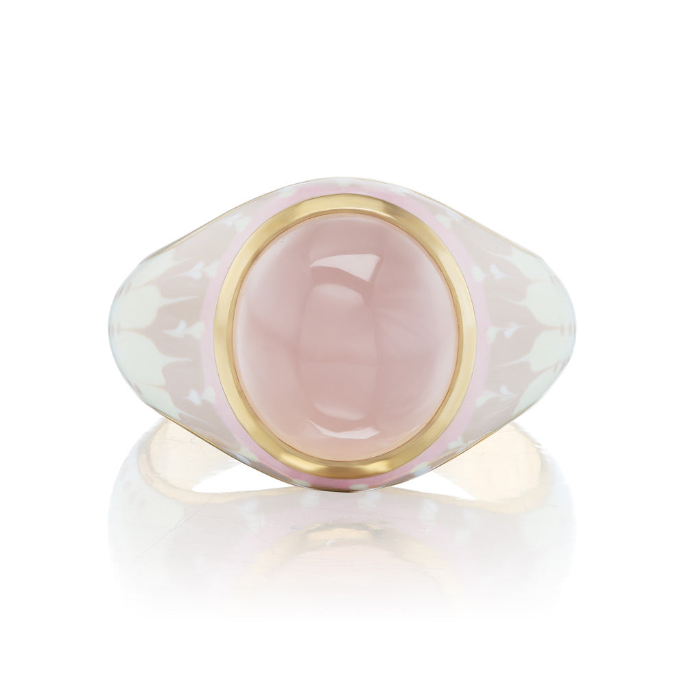 A pink stone KWIT Orb Ring with gold accents and a yellow gold setting.