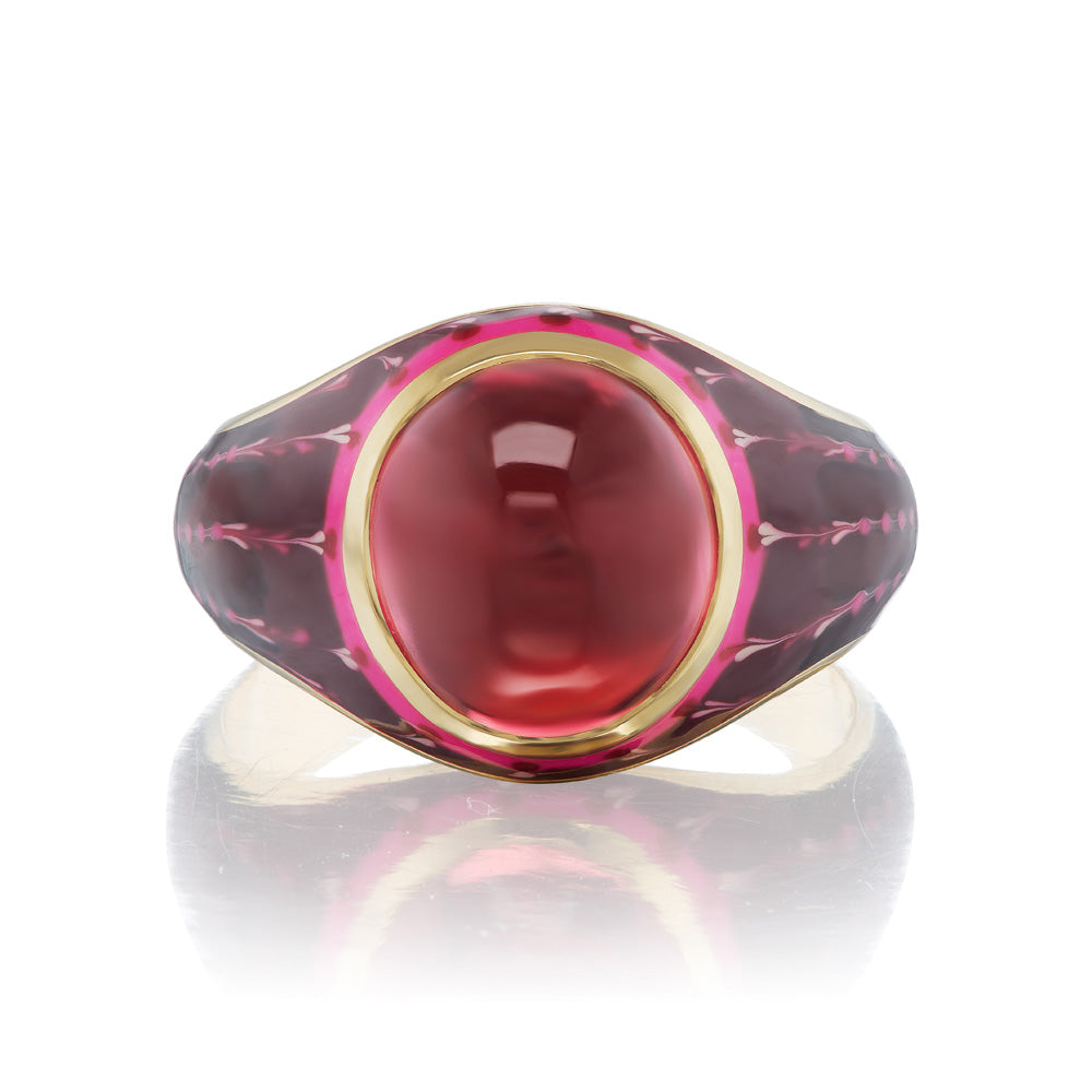 A KWIT Orb Ring with a pink stone in a yellow gold setting.