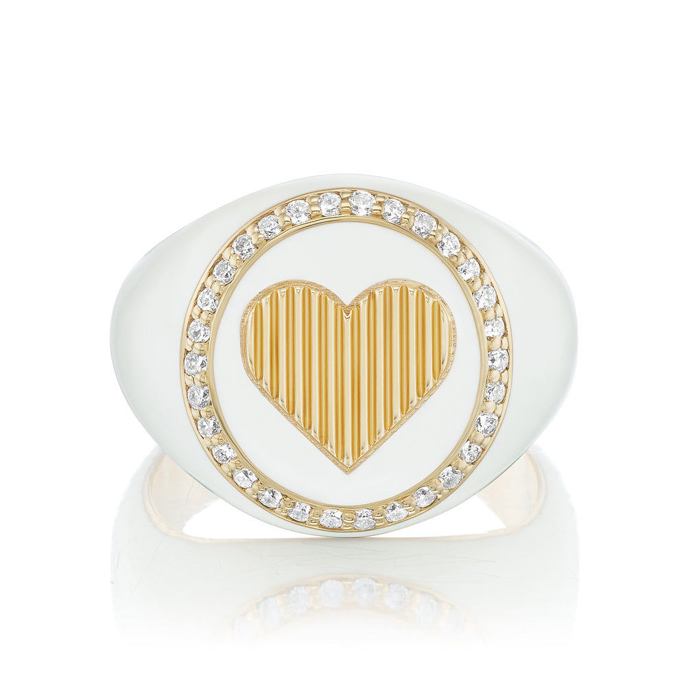 A white diamond-encrusted KWIT gold Heart Signet Ring.