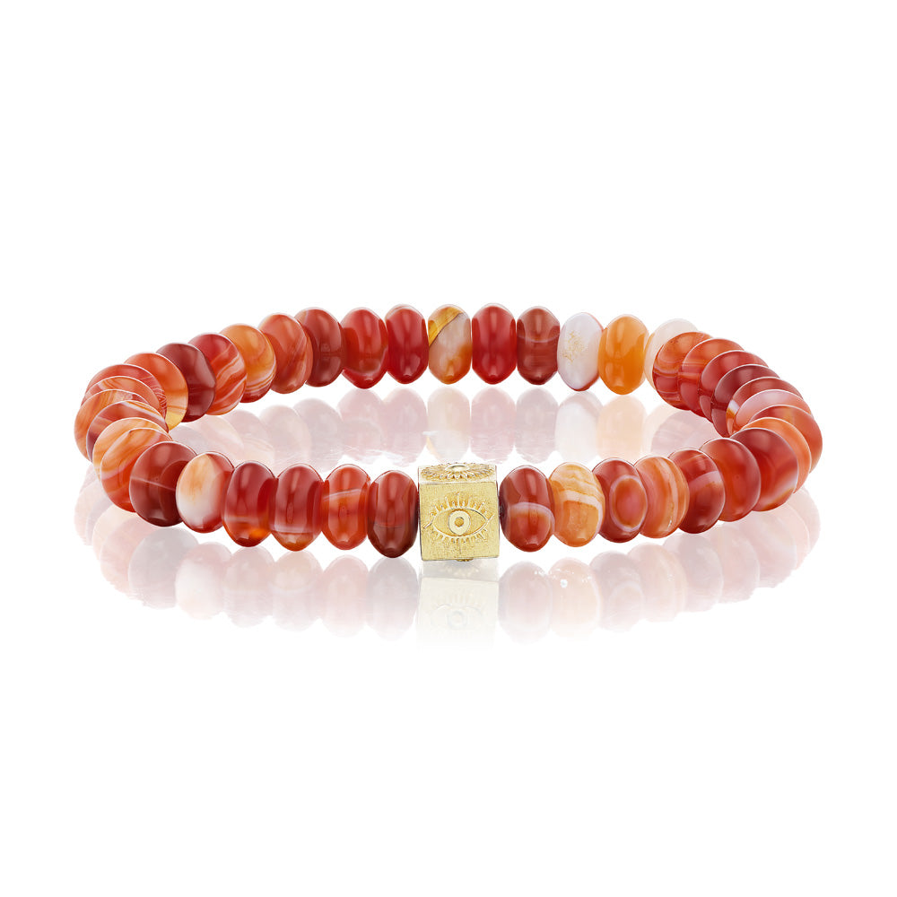 A Beaded Cube Bracelet with red agate stone beads and a yellow gold bead by Luis Morais.