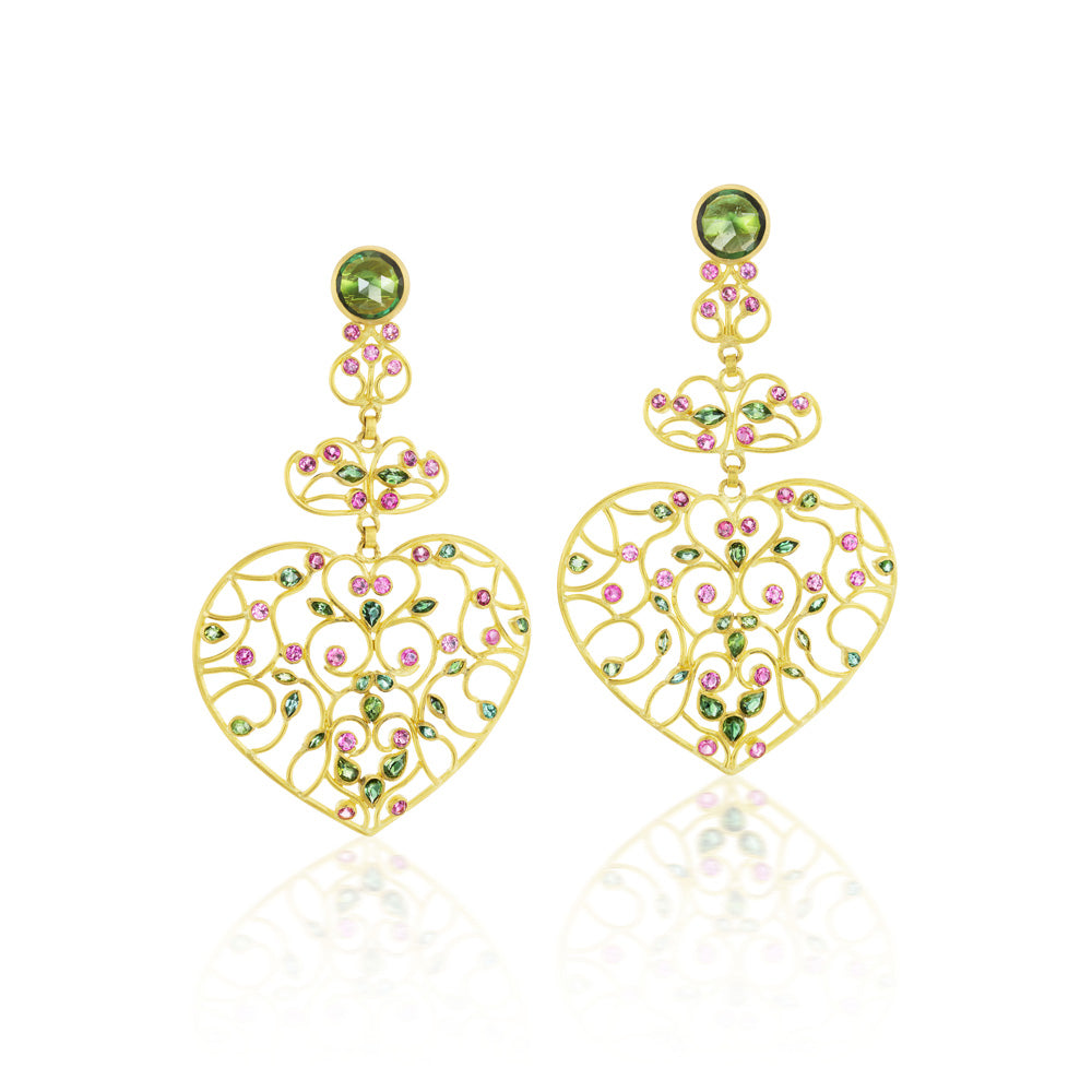 A pair of Vinework Heart Earrings adorned with pink tourmalines and green stones from Munnu.