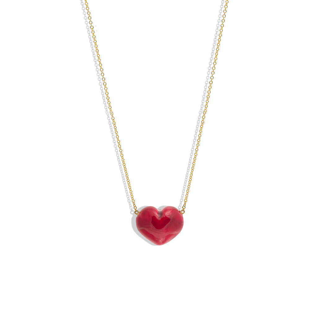 A Puffy Heart Necklace by Christina Alexiou, on a yellow gold chain with an adjustable length.