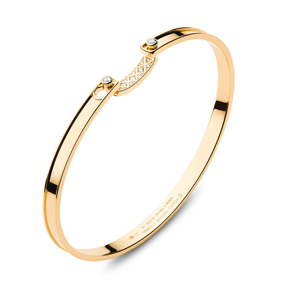 A "Parisian Stroll Mood Bangle" by Nouvel Heritage, adorned with round diamonds.