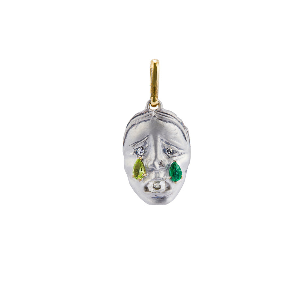 A Cry Baby Mask Emerald Charm pendant by NGHI with emerald stones.