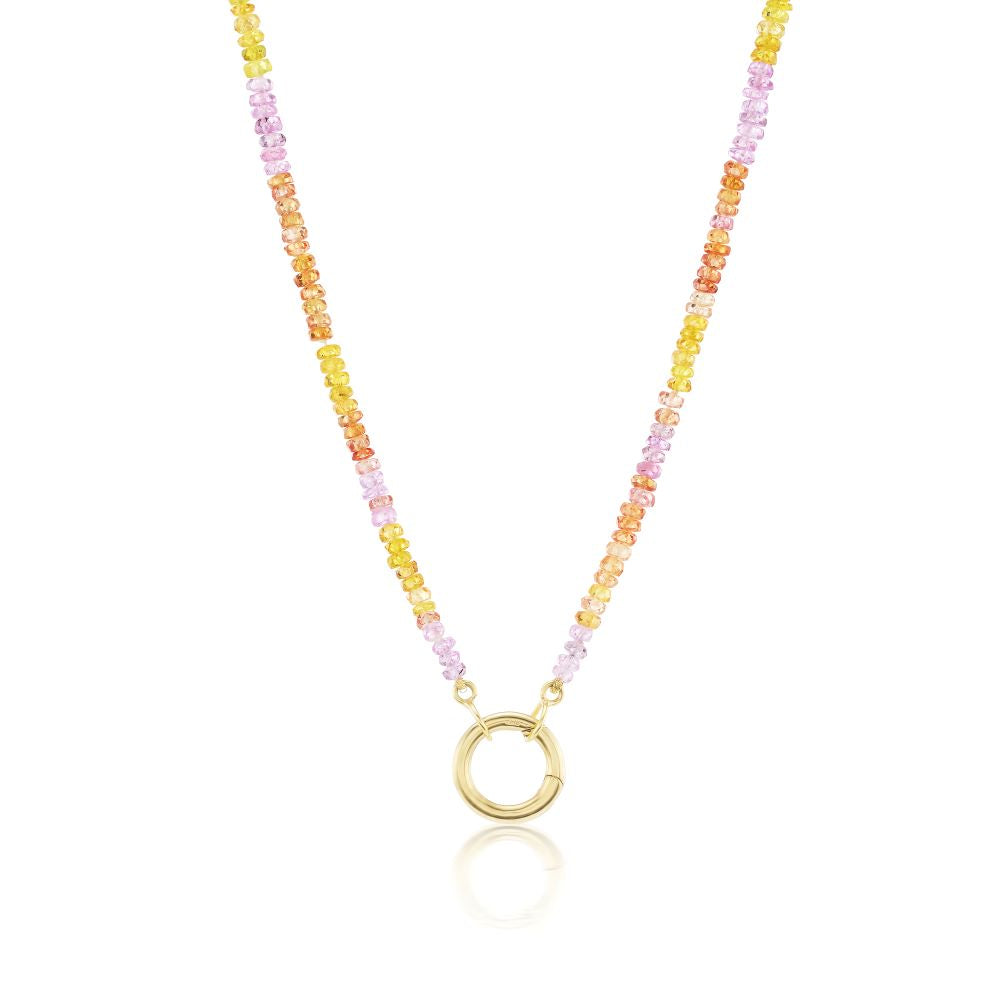 A vibrant, Anna Maccieri Rossi sapphire beaded necklace with a yellow gold-plated circle.