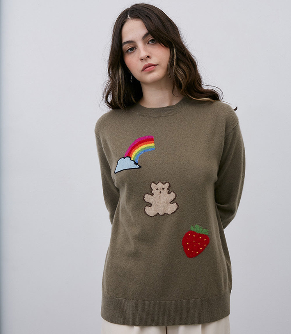 A woman wearing a cozy Leret Leret No. 52 Teddybear Sweater.