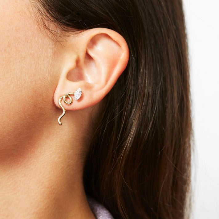 A woman's ear with a Vine Marquise Earring by Bea Bongiasca, featuring gold earrings.