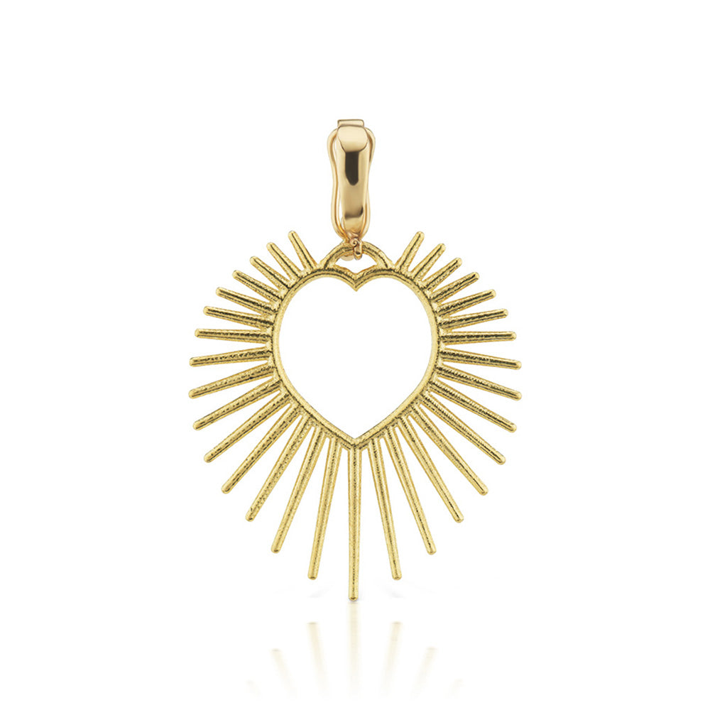 A Halo Heart Charm pendant from Tara Hirshberg, made of yellow gold, on a white background with a sunburst design.