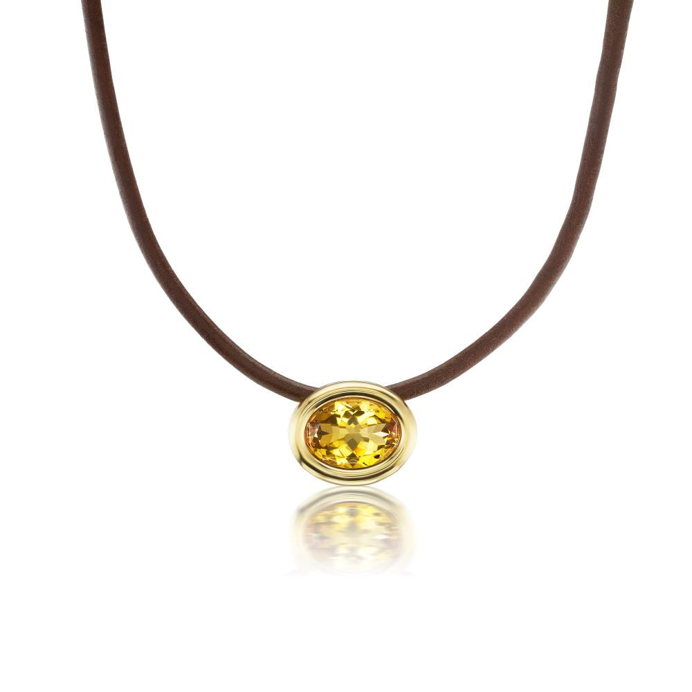 A Scuba Choker Necklace with a yellow citrine stone on a brown leather cord.